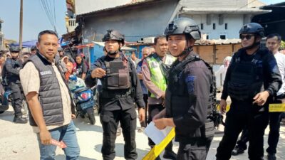 Warga Pasar Kemis panik temukan kotak mencurigakan. Gegana periksa, ternyata berisi bangkai kucing, situasi aman.